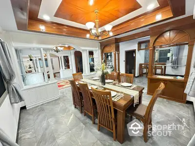 Elegant dining room with wooden ceiling and modern decor