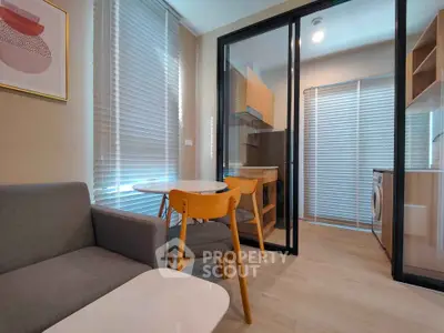 Modern apartment interior with cozy living room and stylish kitchen featuring wooden furniture and large windows.