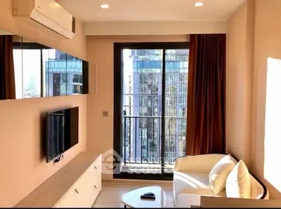 Modern living room with balcony view in high-rise apartment