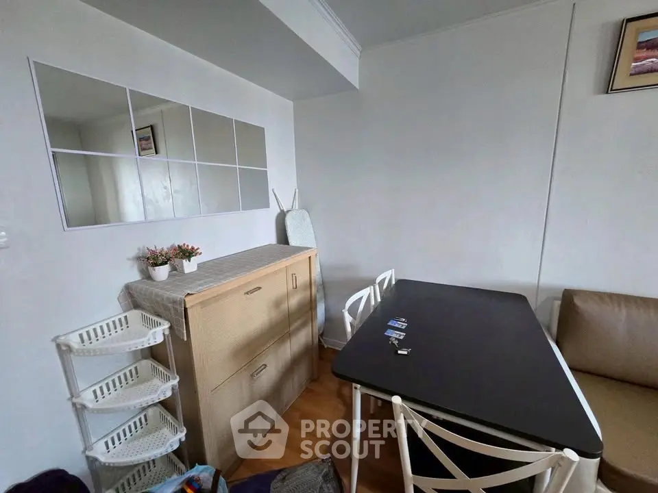 Cozy dining area with modern table and chairs, perfect for intimate gatherings.