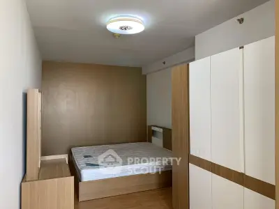 Modern bedroom with minimalist design and ample storage space