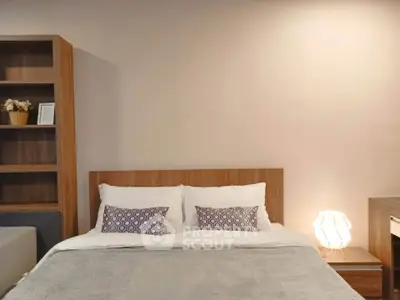 Cozy bedroom with modern wooden furniture and soft lighting, perfect for relaxation.