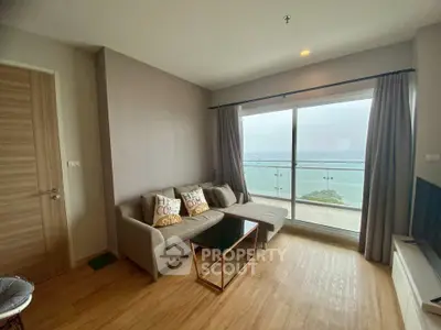 Modern living room with ocean view and cozy seating area
