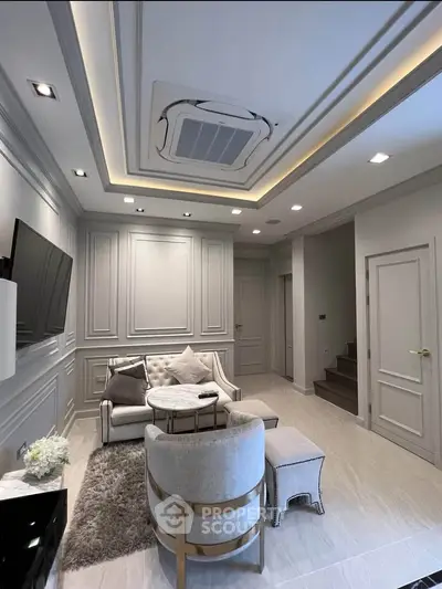 Elegant living room with modern ceiling design and cozy seating area