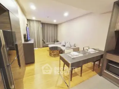 Modern living room with open layout and stylish furniture in a cozy apartment.