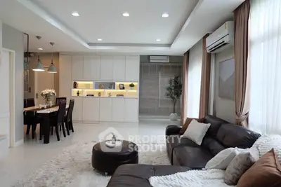 Spacious modern living room with elegant decor and ample natural light