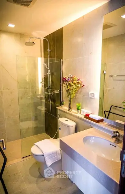 Modern bathroom with glass shower and elegant fixtures