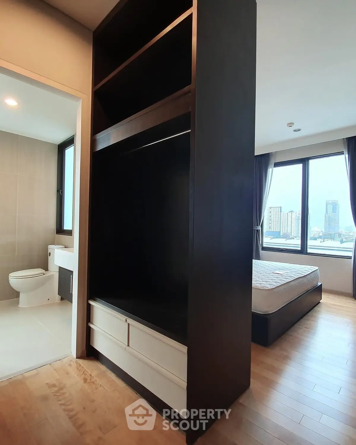 Modern apartment with bedroom, bathroom, and city view