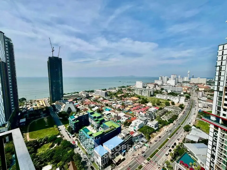 Stunning cityscape with ocean view from high-rise building balcony