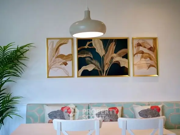 Stylish dining area with modern decor and elegant lighting, perfect for contemporary living.