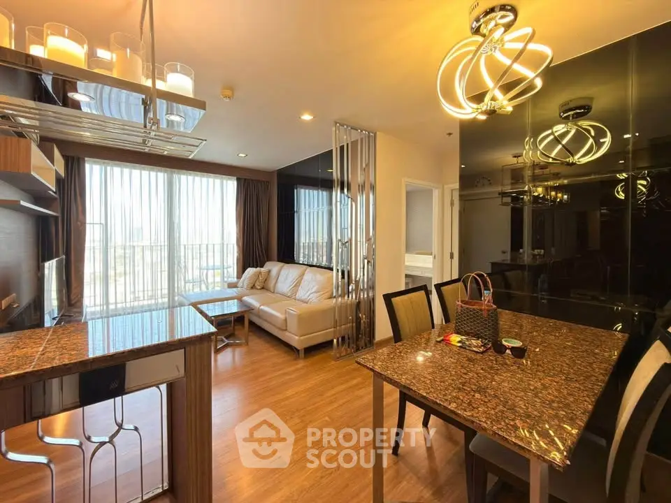 Luxurious open-plan living room with modern lighting and elegant furnishings