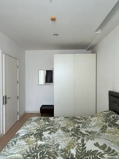 Cozy bedroom with modern decor and ample storage space