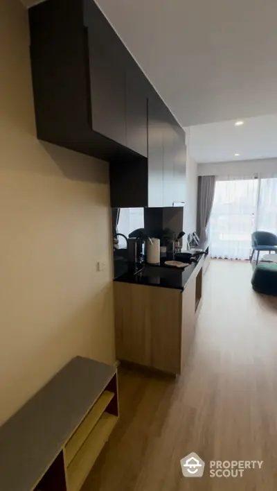 Modern kitchen with sleek cabinets and open layout in a bright apartment