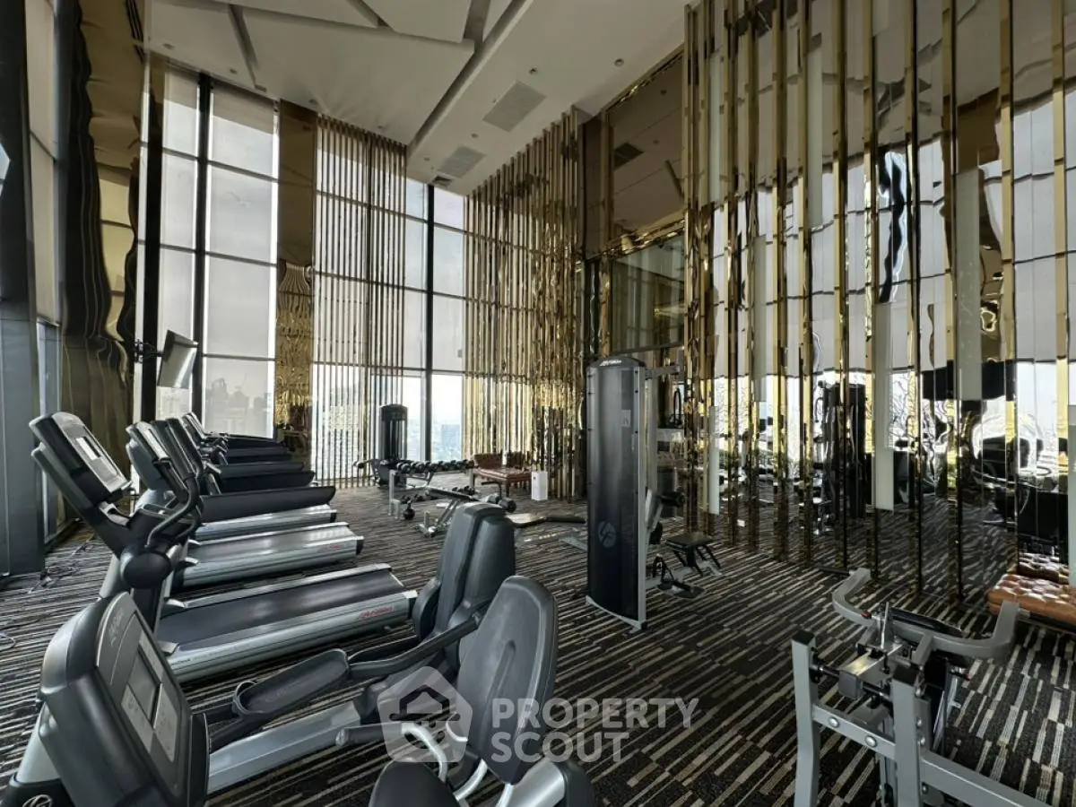 Luxurious high-rise gym with panoramic city views and modern fitness equipment.