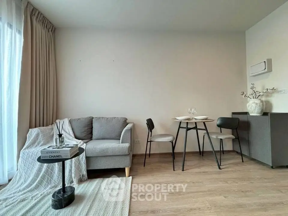 Modern living room with cozy sofa and dining area, perfect for relaxation and entertaining.