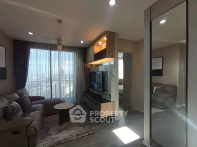 Modern living room with large windows and stylish furniture in a high-rise apartment.