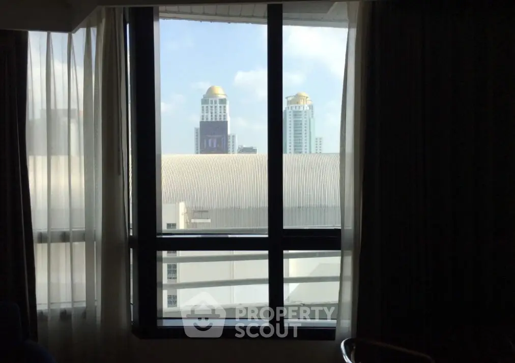 City view from a window with modern skyscrapers in the background