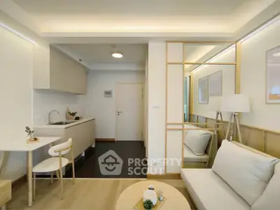 Modern living room with open kitchen and stylish decor