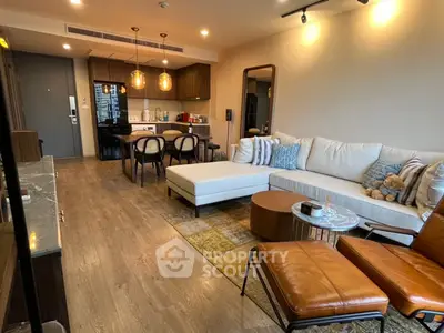 Spacious modern living room with stylish furniture and open kitchen layout