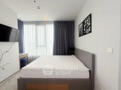 Modern bedroom with large window and stylish decor