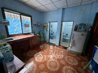 Spacious kitchen with unique tile flooring and ample storage space