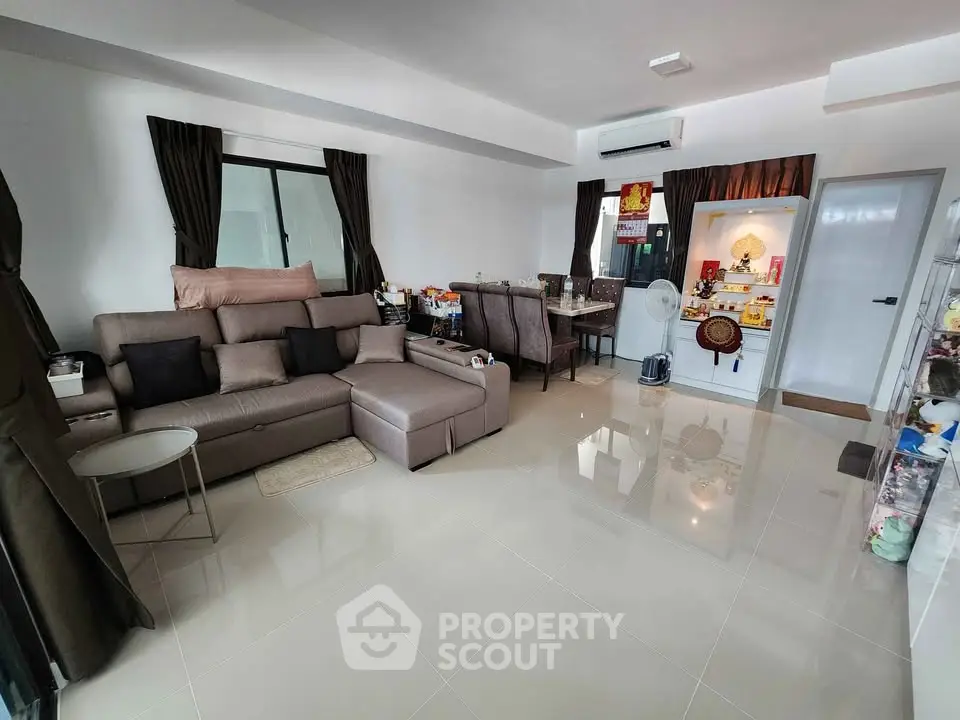 Spacious living room with modern decor and ample natural light