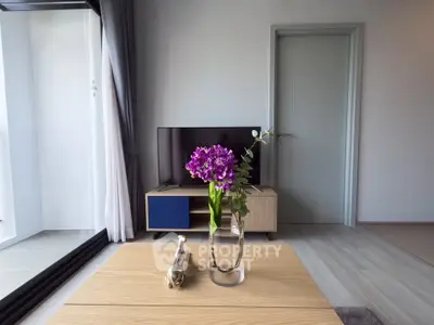 Modern living room with stylish decor and large window view