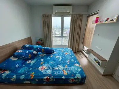 Cozy bedroom with city view, featuring stylish decor and ample natural light.