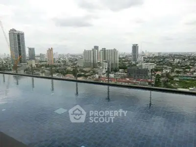 Stunning rooftop infinity pool with panoramic city skyline views, perfect for luxury urban living.