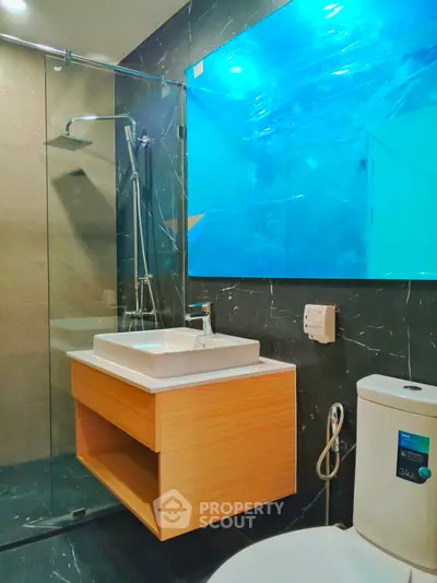 Modern bathroom with sleek design and glass shower enclosure