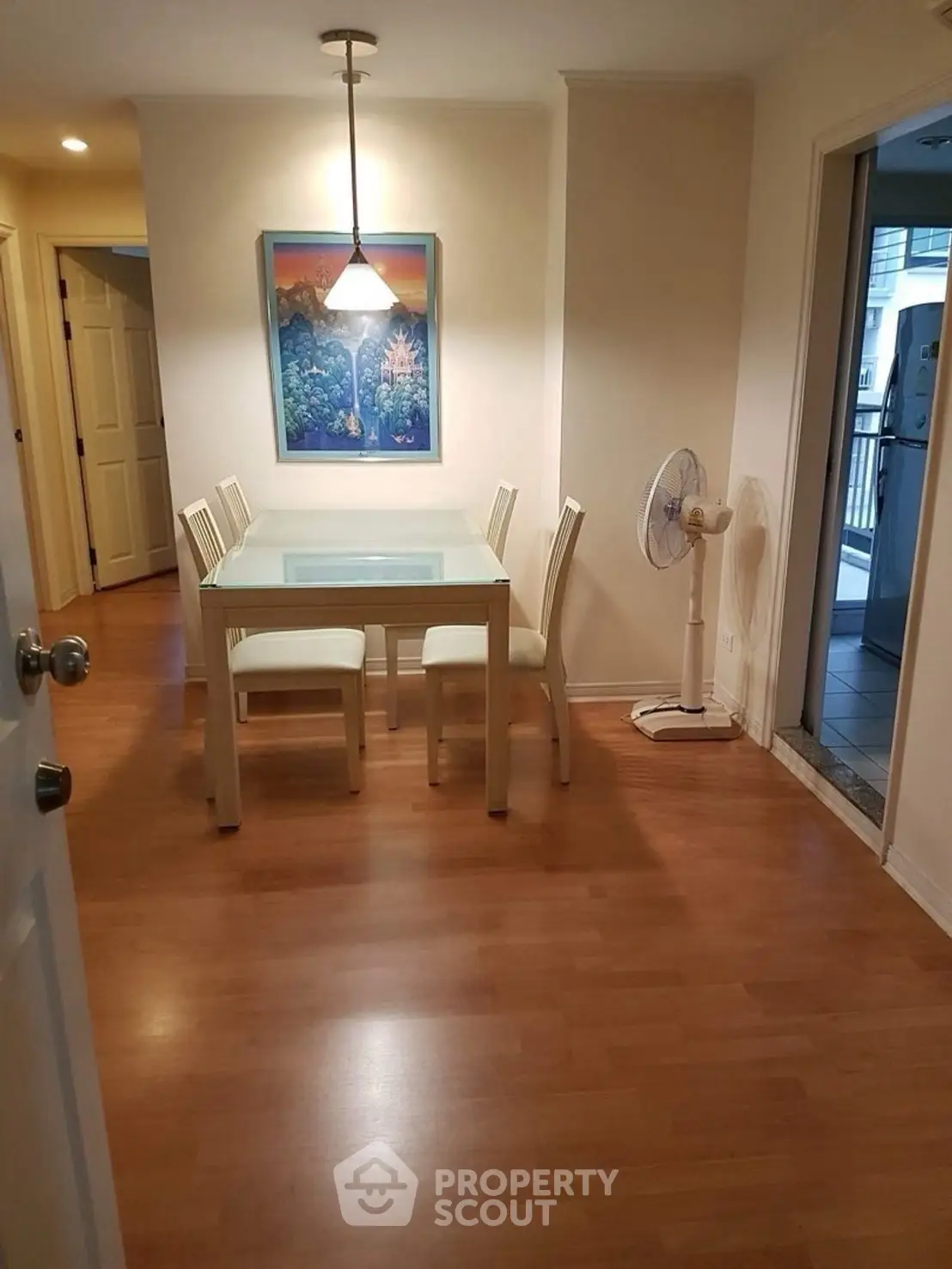 Charming dining area with wooden flooring and modern decor, perfect for cozy family meals.