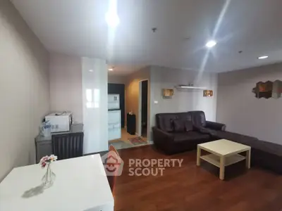 Spacious living room with modern furniture and wooden flooring