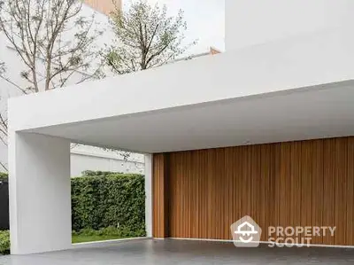 Modern minimalist garage with wooden paneling and sleek design