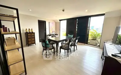Spacious dining area with modern decor and large windows offering city views.