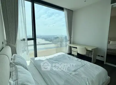 Luxurious bedroom with stunning river view and modern furnishings