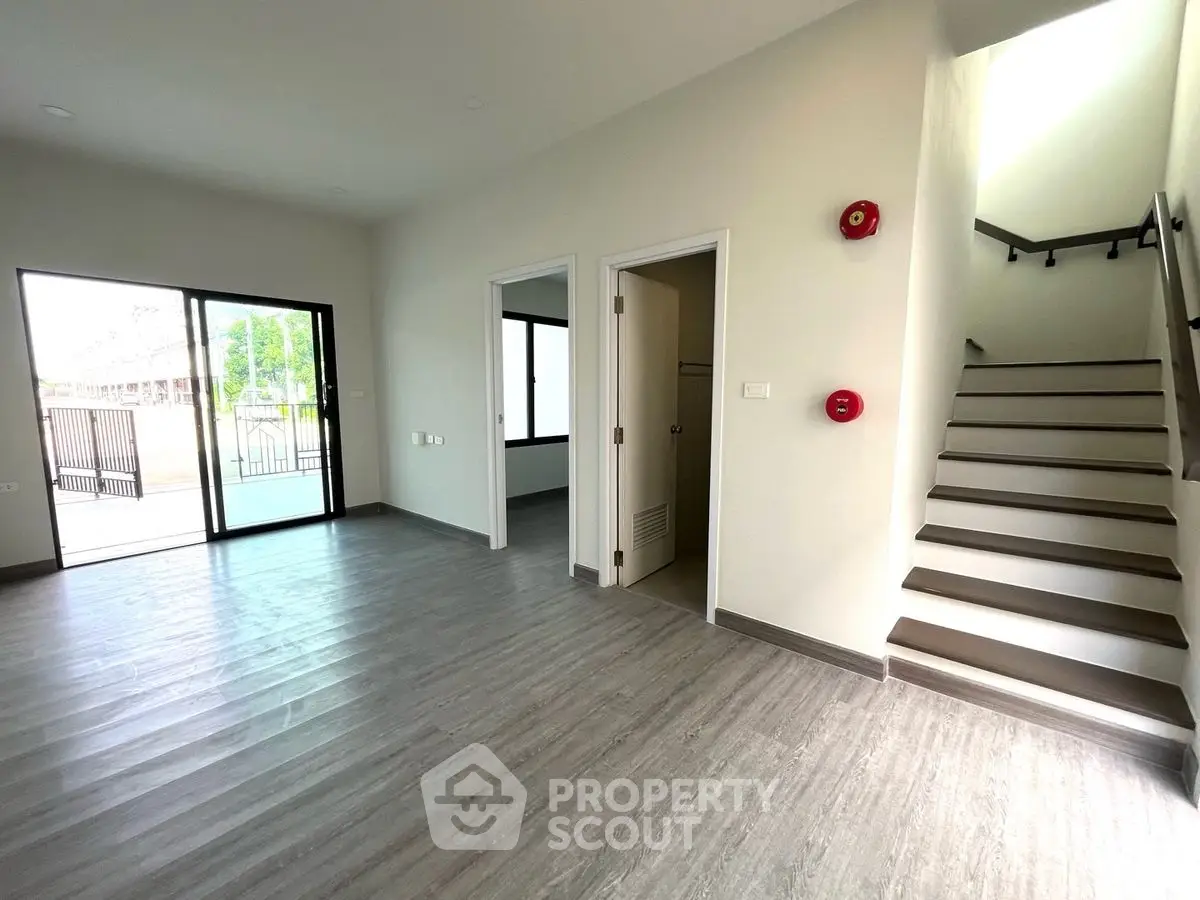 Spacious modern interior with staircase and large windows