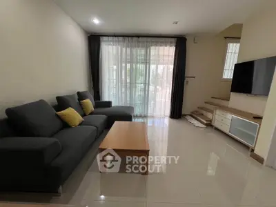 Spacious living room with modern furniture and natural light