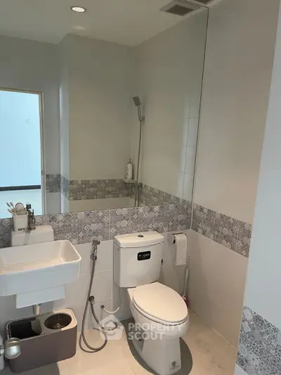 Modern bathroom with sleek fixtures and stylish tile accents
