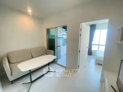 Modern apartment interior with cozy living area and bright bedroom view.