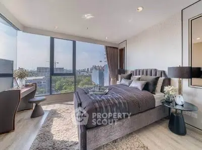 Luxurious bedroom with city view, modern decor, and elegant furnishings.