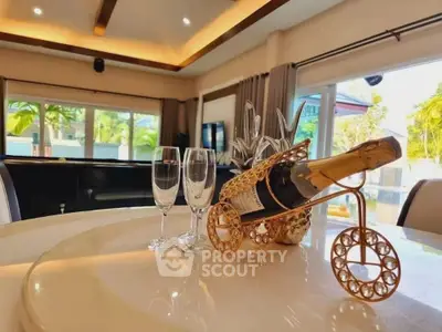 Luxurious living room with elegant decor and champagne set, perfect for entertaining.