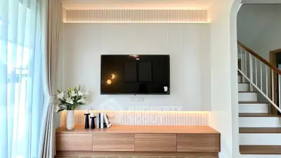 Modern living room with sleek TV setup and elegant decor