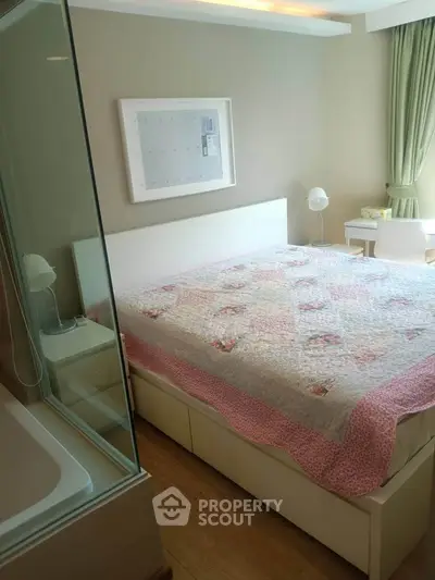 Cozy bedroom with elegant decor and natural light, featuring a comfortable bed and stylish furnishings.