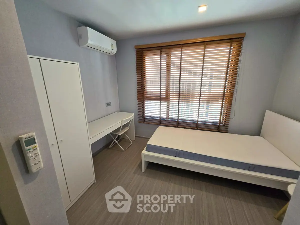 Modern bedroom with air conditioning and natural light