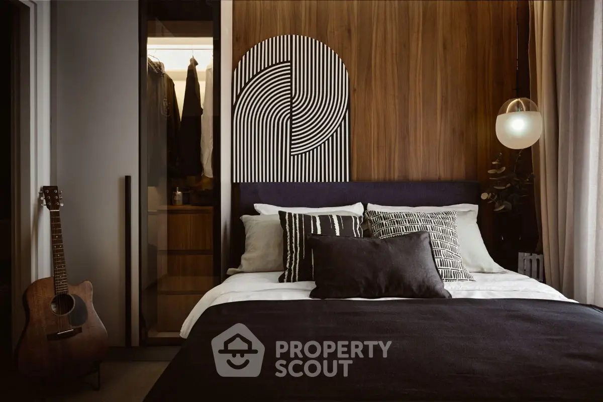Stylish modern bedroom with cozy decor and walk-in closet, perfect for urban living.