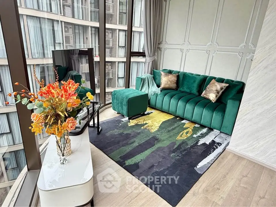 Luxurious living room with green velvet sofa and floor-to-ceiling windows