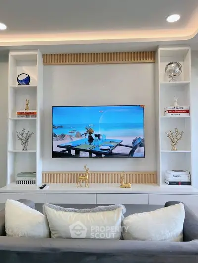 Stylish living room with modern decor and wall-mounted TV