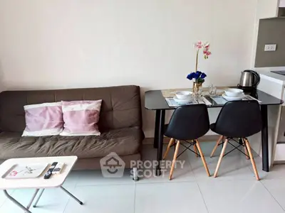 Modern living room with cozy sofa and dining area in stylish apartment.