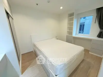 Modern minimalist bedroom with built-in storage and natural light