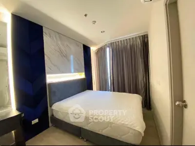 Modern bedroom with stylish decor and natural light in a contemporary apartment.